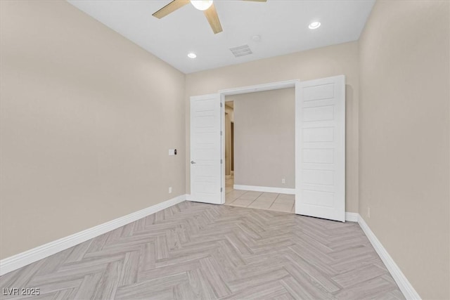 unfurnished bedroom featuring ceiling fan and light parquet flooring