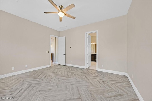 unfurnished bedroom featuring ceiling fan, connected bathroom, and light parquet floors