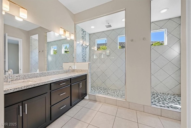 bathroom with vanity, tile patterned floors, and tiled shower