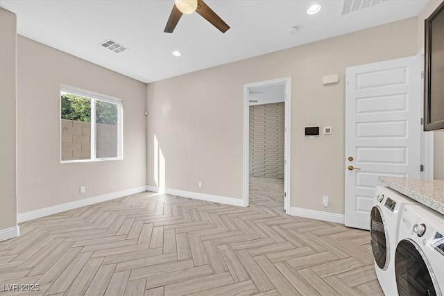 interior space with washer and dryer, light parquet flooring, and ceiling fan