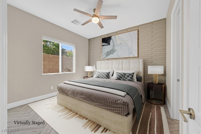 bedroom featuring ceiling fan and light parquet flooring