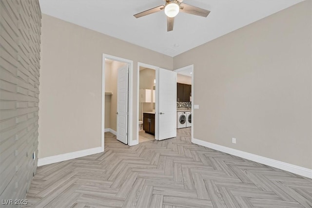 unfurnished room with ceiling fan and independent washer and dryer