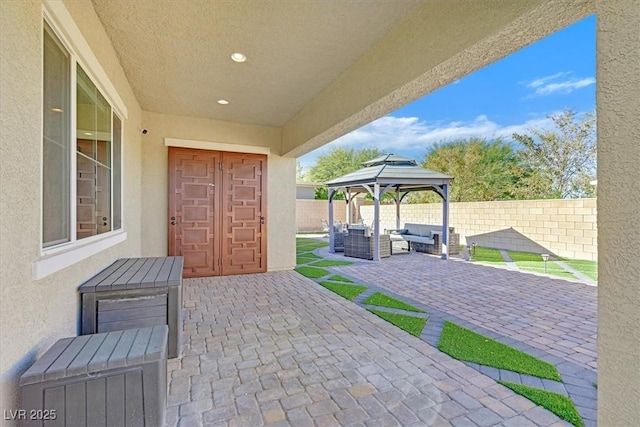 view of patio / terrace featuring an outdoor hangout area and a gazebo