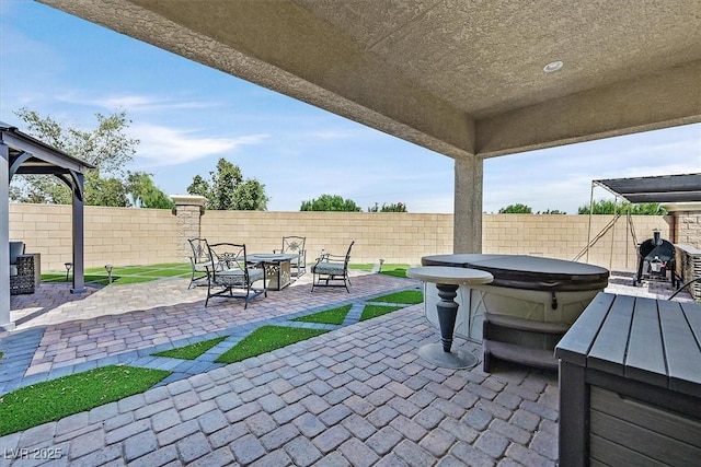 view of patio featuring a hot tub