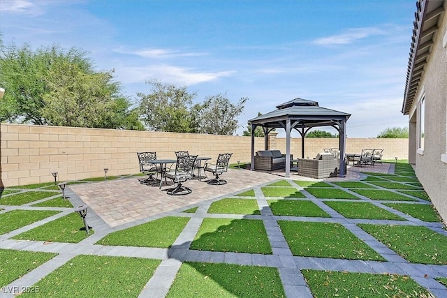 view of patio / terrace featuring an outdoor hangout area and a gazebo