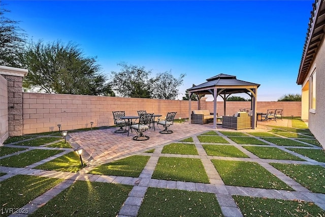 view of yard with outdoor lounge area, a gazebo, and a patio