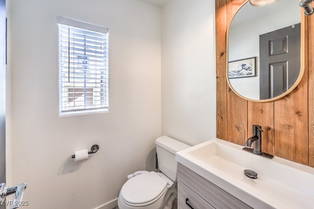 bathroom featuring toilet and vanity