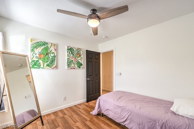 bedroom featuring light wood-type flooring and ceiling fan