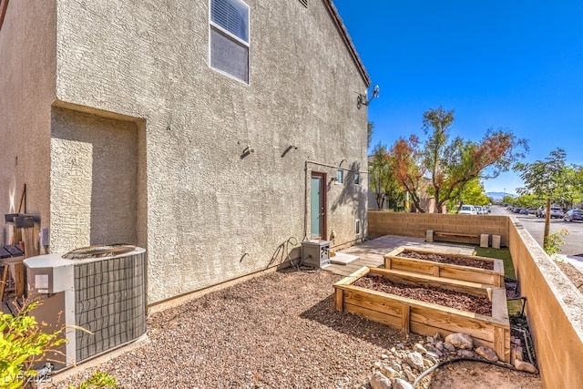 rear view of property with cooling unit and ac unit