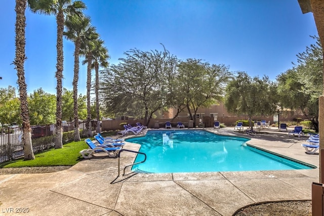 view of swimming pool with a patio area