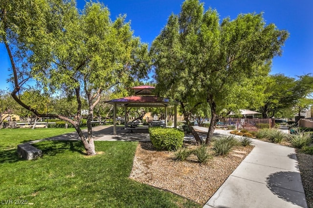 surrounding community featuring a gazebo and a lawn