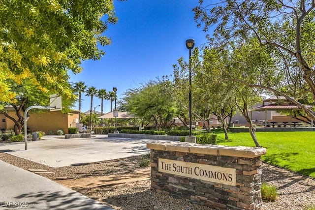 view of home's community featuring basketball court, a gazebo, and a lawn