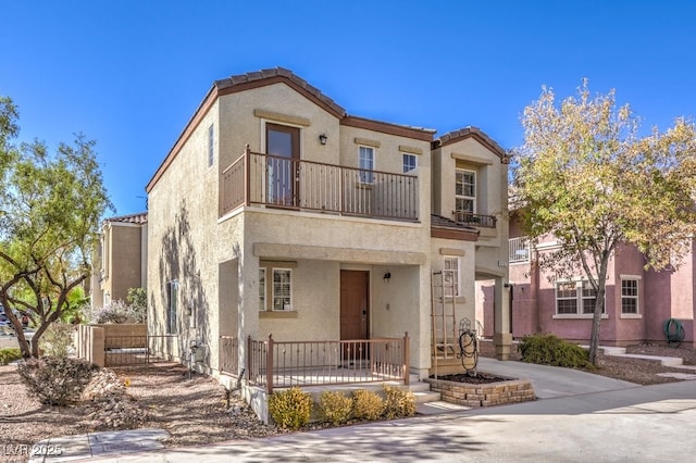 view of front of home featuring a balcony