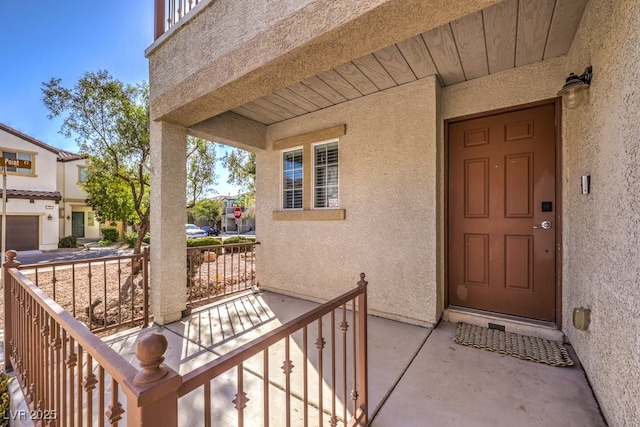 entrance to property featuring covered porch