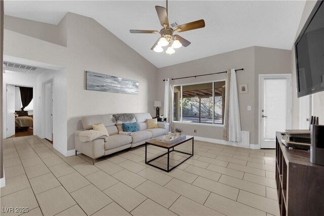 living room featuring ceiling fan, light tile patterned floors, and high vaulted ceiling