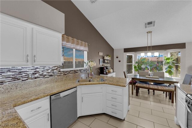 kitchen featuring decorative backsplash, decorative light fixtures, white cabinets, and dishwasher