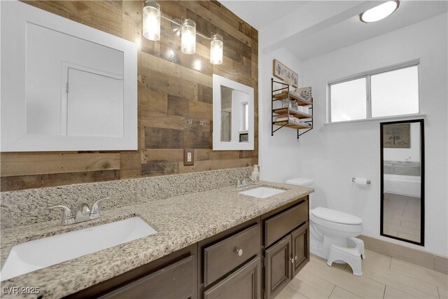 bathroom with tile patterned floors, a shower with door, vanity, wooden walls, and toilet