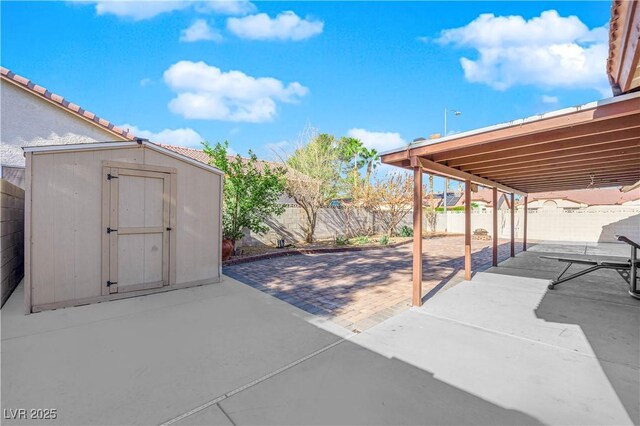 view of patio with a storage shed