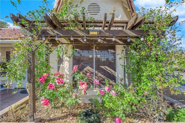 view of outdoor structure featuring a pergola