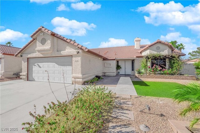 mediterranean / spanish-style house featuring a garage