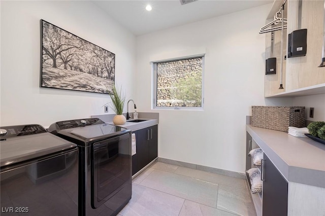 1 Boulderback Dr, Henderson, NV 89012 - laundry area with cabinet space, washing machine and clothes dryer, light tile patterned floors, baseboards, and recessed lighting
