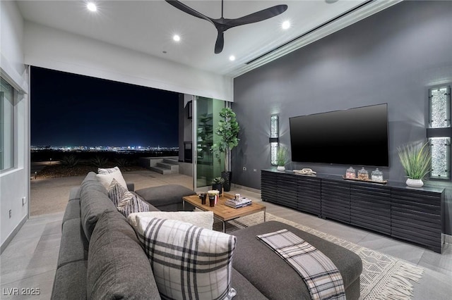 living room featuring ceiling fan and crown molding