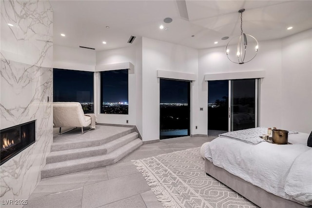 1 Boulderback Dr, Henderson, NV 89012 - bedroom with a premium fireplace, recessed lighting, and a chandelier