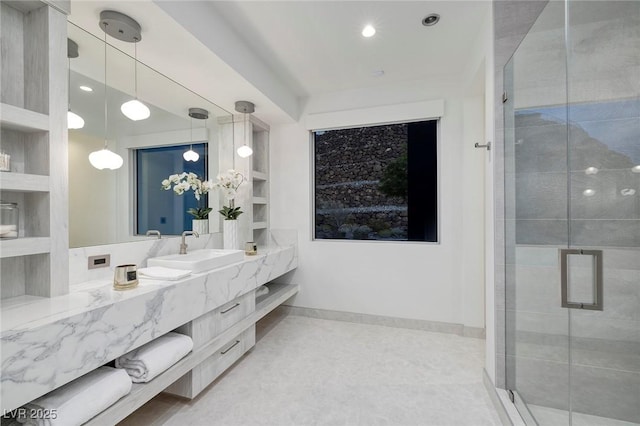 bathroom featuring vanity, an enclosed shower, and built in shelves