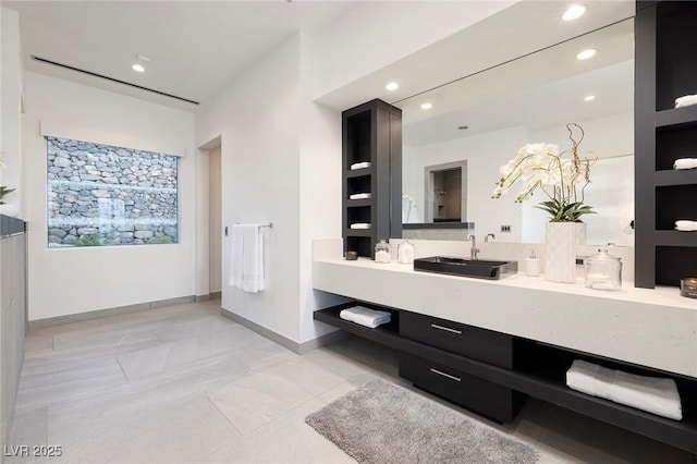 bathroom with tile patterned flooring and vanity