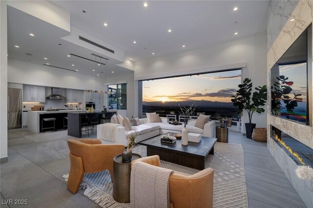 living room with a towering ceiling