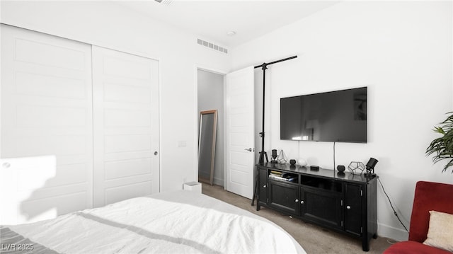 carpeted bedroom featuring a closet