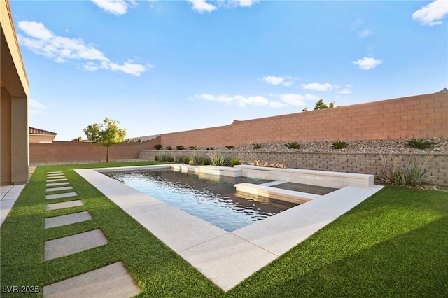 view of swimming pool featuring a yard