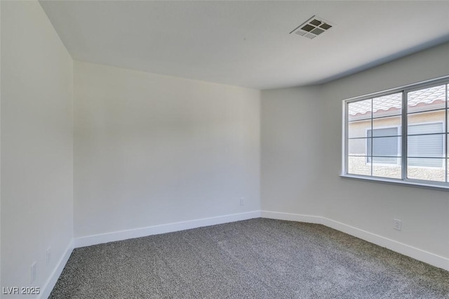 empty room featuring carpet flooring