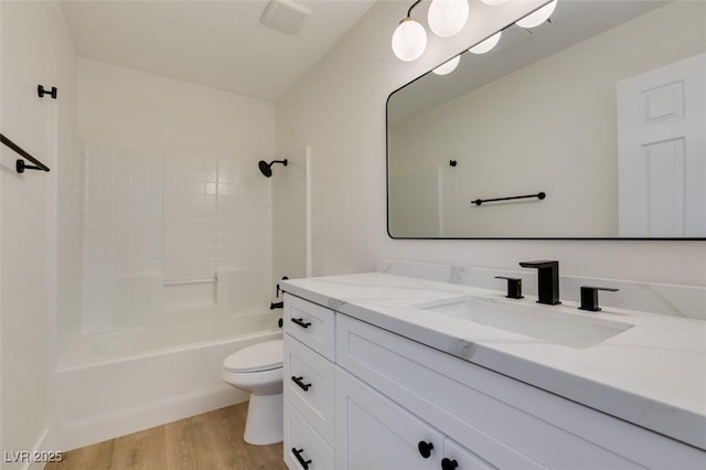 full bathroom with toilet, vanity, tub / shower combination, and hardwood / wood-style flooring