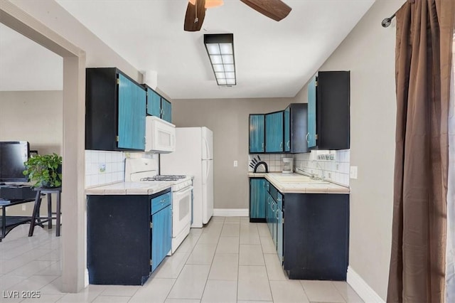 kitchen with tasteful backsplash, white appliances, blue cabinetry, and ceiling fan