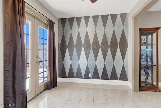 foyer entrance with ceiling fan and a wealth of natural light