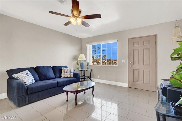 living room with ceiling fan and light tile patterned floors