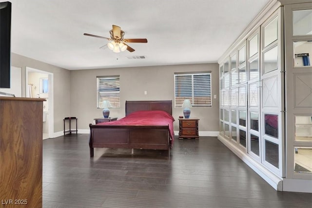 bedroom featuring ceiling fan and dark wood-type flooring