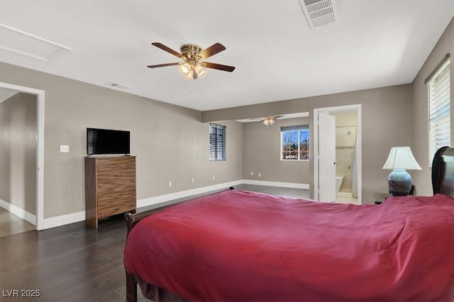 bedroom featuring ceiling fan, connected bathroom, and dark hardwood / wood-style floors