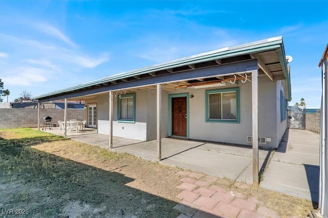 back of house with a patio area