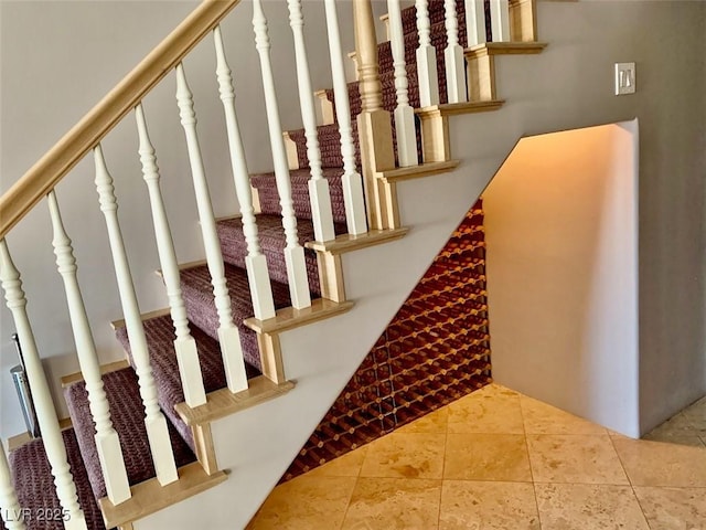 stairs featuring tile patterned flooring