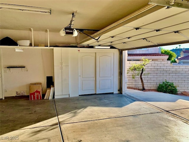 garage featuring a garage door opener