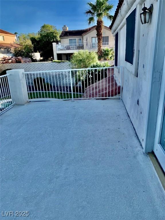 view of patio featuring a balcony