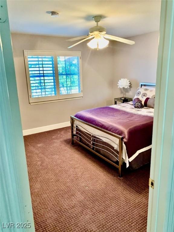 bedroom with ceiling fan and carpet flooring