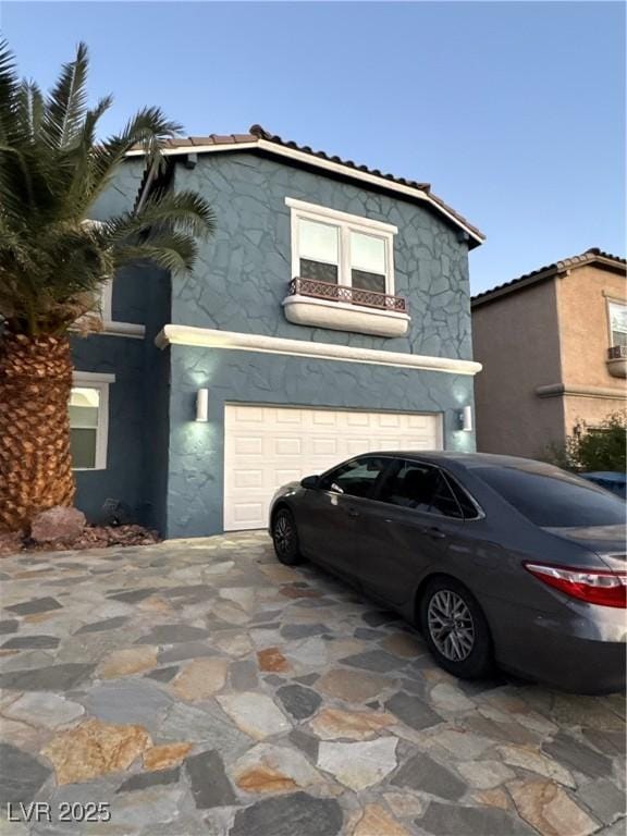 view of front of home with a garage