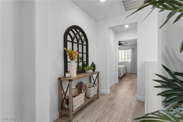 corridor featuring light hardwood / wood-style flooring