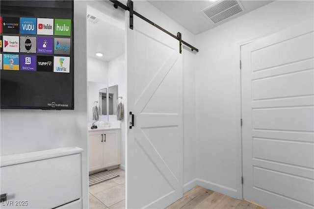 mudroom with a barn door