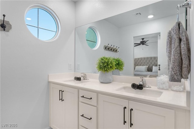 bathroom featuring ceiling fan and vanity