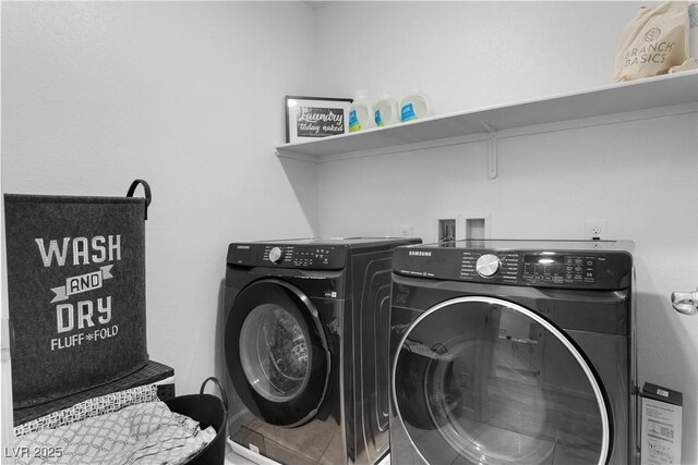 clothes washing area featuring washing machine and dryer