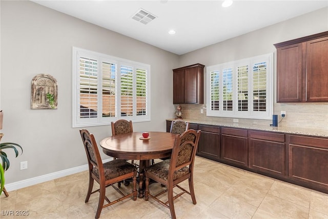 dining area featuring light tile patterned flooring